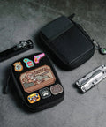 EDC Pocket Organizer Pouch With DIY Patches Area Nylon Utility Pocket For Everyday Carry next to multi-tool and flashlight