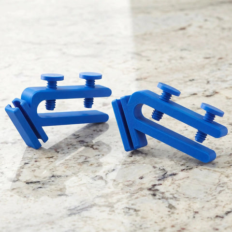 Adjustable Abs Hose Holder Clamps for Bucket and Garden Hose Storage 2 Pc Set on a stone surface