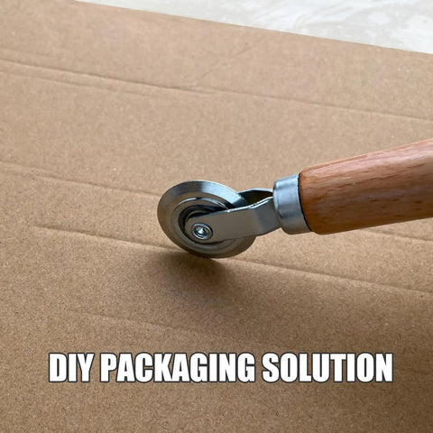 Top Tier 5 Piece Box Resizer Kit Featuring Scoring Wheel Perforator on cardboard, ideal for DIY custom shipping cartons.