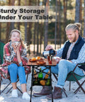 Couple using Portable Camping Table With Adjustable Height From 15.8 To 22 Inches Folding Outdoor Table With Storage Bag.