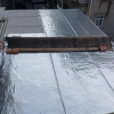 Hella Tough Asphalt Roof Shingle Repair Tape With Reflective Aluminum Foil Backing offers waterproof shield on flat roof surface.
