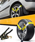 Four Pack Beefy Car Tie Down Straps For Trailers Two Inch By Ninety Six Inch With 9900 Lbs Break Strength Tire Ratchet Straps with J Finger Hooks securing car and tire.