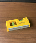 QERDIVO Spirit Levels Mini Horizontal Vertical Pockets Spirit Levels Spirit Bubble Leveler on wooden surface.