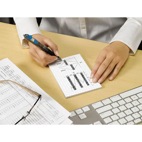 Person using Sticky Grid Notes 4x6 Inches, 6 Pads With 50 Sheets Each, White Paper With Blue Grid, on desk next to keyboard and papers.