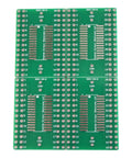 Four green SMD To DIP Breakout PCB Module With SOIC 28 To DIP Adapter, dual row header, SMT resistor and capacitor pads, 28 pin wide.