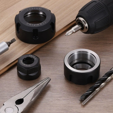 Five Pieces ER16A M22 Collet Clamping Nuts Set For CNC Milling Chuck Holder Lathe on workbench with drill and tools