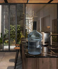 Electric USB Charged Water Dispenser Pump For 2 To 6 Gallon Bottles in a modern kitchen setting