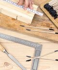 30 Pack Sanding Sticks For Wood And Plastic Models, Double Ended Tools With Matchstick Design, 120 And 280 Grit, 5.4 By 0.2 Inch, on a workbench with measuring tools
