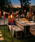 Group enjoying garden with 55 Inch Outdoor Oil Torch Lamps 2 Pack In Rose Gold, Rustproof Stainless Steel Citronella Torches