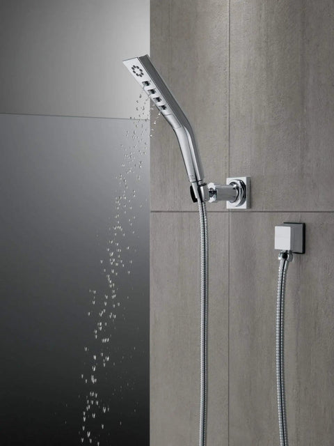 H2Okinetic Wall Mount Hand Shower With Massaging Spray And Pause Feature, chrome finish, mounted on modern tiled wall