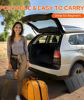 Woman holding Go To All In One Portable Power Station With 100W Solar Generator, car trunk open with foldable 40W panel and bag