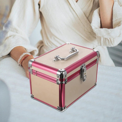 Sweet Aluminum Alloy Pedicure Rig With Layered Lockable Storage For Nail Techs And Makeup Pros To Keep Your Kit Clean And Secure While Hitting the Road For Home Or Office Jobs Without A Hassle, portable pink aluminum storage case on a table.