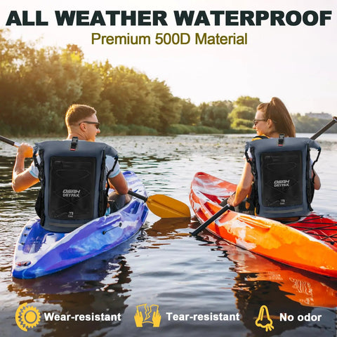 Two kayakers with Heavy Duty Waterproof Dry Bag Backpack 35L 55L 85L With Roll Top Closure For Travel And Outdoors Ultra Rugged 500D PVC Welded Seams Keeps Gear Dry In Rain Kayaking Boating Camping Rafting And Fishing Adventures on their backs, paddling a blue and orange kayak on a river with lush greenery in the background.