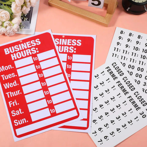 Two Piece Open Closed Sign Kit For Glass Doors And Windows In Bright Red And White, Hours Of Operation Signs for businesses displayed on a table