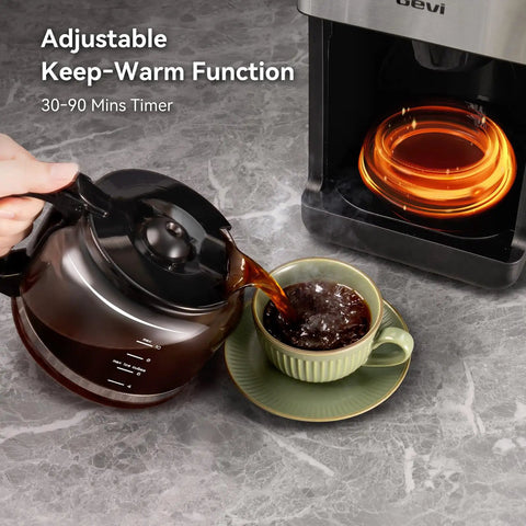 10 Cup Grind And Brew Coffee Maker Featuring A Sleek Touch Display, Programmable Schedule, Custom Grind Levels, Smooth Sip Keep Warm, And Hassle Free Set It Forget It Automation For Daily Caffeine Cravings pouring fresh coffee into a cup from a glass carafe.