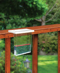 Easy Mount Waterfall Rain Gauge With Slide On Bracket Deck Or Fence Rail Compatible Backyard Rain Monitor Up To Six Inches Durable Plastic Frame Wide Waterfall Design Easy Install And Readout installed on wood fence rail in garden