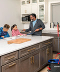 Family kitchen scene with RinseClean Spin Mop And Bucket System For Clean Water Mopping Lets You Clean With Clean Water From Start To Finish.
