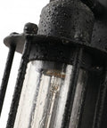 Close-up of Industrial Outdoor Porch Wall Light Sconce Set Of 2 In Matte Black 18 Inch weather-resistant glass and steampunk cage.