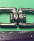 Top Shelf Marine Grade 316 Stainless Steel Anchor Swivel Eye And Eye 6mm 1/4 Inch Heavy Duty Boat Rigging Hardware on green background