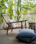 Outdoor Pillow Inserts Pack of 2, 26 by 26 Inches, Water Resistant Cushions on patio chair with plants on porch