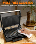 Premium Baker's Friend Mini Panini Press Electric Grill with a clean surface and oil drip tray, easy to wipe down.