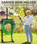 Outdoor Garden Hose Holder Stand With 5 Spikes And 2 Shepherd Hooks Freestanding Heavy Duty Hose Rack in garden setting
