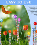 Kick Up Your Garden Game With This DIY Beaded Stake Kit Set Of 8 Threaded Rods Paired With Hex Nuts And Diamond Stopper Caps To Create Magical Fairy Yard Decor That Will Seriously Level Up Your Outdoor Vibes featuring colorful garden stakes and flowers.