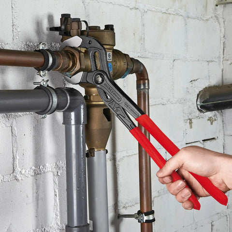 Cobra XL Water Pump Pliers with One Handed Adjustment and Guard in use on water pipes, demonstrating secure grip and durability.