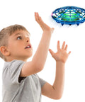 Child playing with Hand Operated Scoot Drone For Kids And Adults With Hands Free Motion Sensor LED Indoor UFO Toy Rechargeable Flying Orb Ball