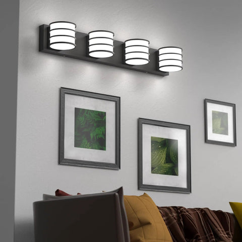 Lit Four Light LED Vanity Fixture In Matte Black With White Acrylic Shades, 28.4 Inch Long, mounted above wall art