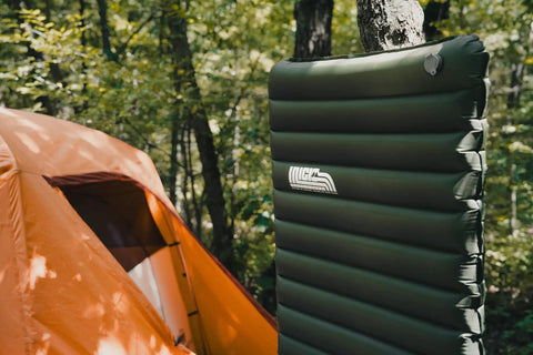 Ultralight Camping Sleeping Pad For Backpacking Rugged Inflatable Mattress With Pump Sack And Repair Kit 72 By 25 Inches in forest