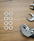 Stainless Steel Door Handle Washers and Spindle Repair Kit 100 Pcs Flat Thin Shims 8x12x0.1mm Door Knob Spacers for Home Hardware Maintenance and Furniture Repair DIY Ready, washers on wood with pliers