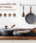 Kickin Nonstick Frying Pan With Swiss Granite Coating on stovetop, woodgrain Bakelite handle, compatible with all cooktops
