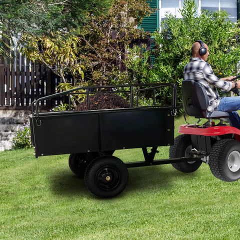 Heavy Duty Steel Dump Cart With 900 Lb Capacity, 15 Cu Ft Utility Trailer, attached to ATV on grass, for garden and yard work