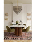 Top Shelf 15 Light Pendant Fixture Featuring Authentic Legacy Brass Finishes And Hand Crafted Grey Smoke Glass over a dining table.