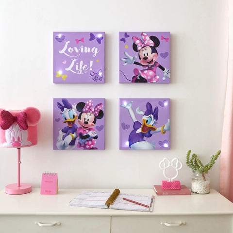 Minnie Mouse LED Canvas Wall Art Set, Four Pack Light Up Panels 11x11 Inches displayed on a wall in a girl's room with playful decor.