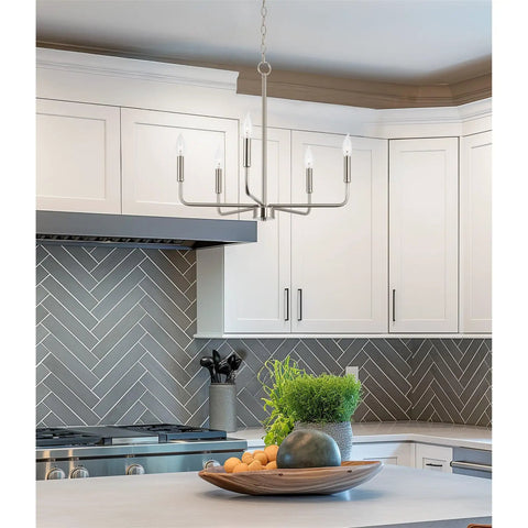 Camille 22 Inch Modern 5-Light Candle Style Chandelier with Open Frame in Brushed Nickel Finish illuminating kitchen area