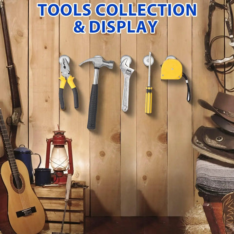 Tools collection on wooden wall with pliers, hammer, wrench, screwdriver, and tape measure alongside guitar and lantern.