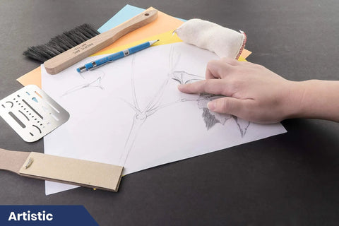 Hand using large dry cleaning pads for drafting art architecture and graphite erasers for smudge free drawings