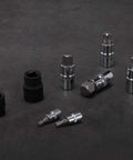 92 Piece Allen And Torx Socket Set For 1/4 3/8 1/2 Inch Drives With tamper proof Torx and Hex bits scattered on dark surface