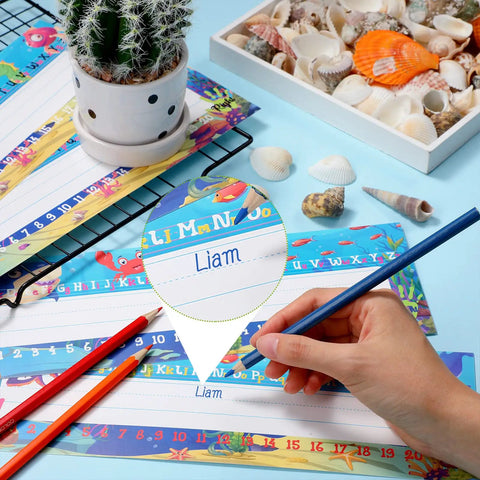 Hand writing on Sea Animal Themed Classroom Name Plates Pack Of 40 With Adhesive Dots Manuscript Alphabet Tags For Desks