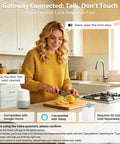 Woman using voice control for keyless entry door lock with app and fingerprint sensor in a kitchen, compatible with smart home systems.