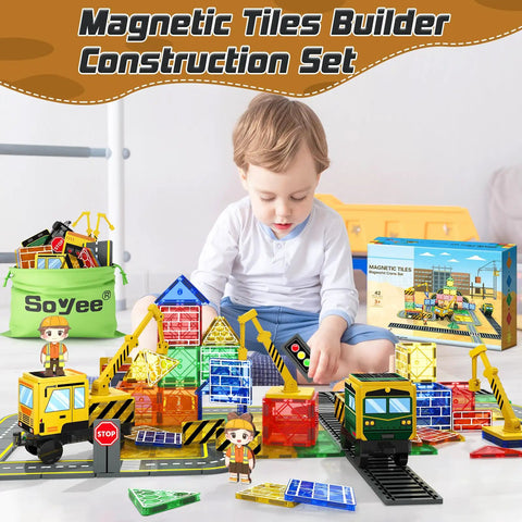 Child playing with Magnetic Tiles Construction Set With Two Cranes STEM Building Blocks For Ages 3-7, featuring colorful tiles and cranes.