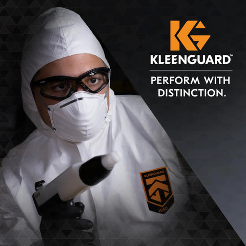 Person in protective suit wearing V30 Nemesis Foam Safety Glasses With Anti Fog Lenses Black Frame Unisex Eyewear.