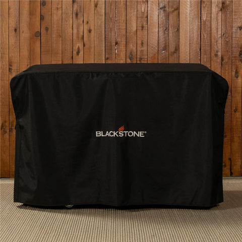 Heavy Duty 28 Inch Griddle Cover With Hood For Flat Top Gas Grills Water And Weather Resistant 600D Polyester With Cinch Straps For Secure Fit And Full Coverage on a wooden patio