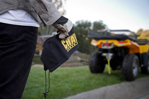 Neoprene Winch Cover For 2000 To 3500 Lb Winches Weather Resistant Protective Sleeve With Adjustable Drawstring Tough As Nails Durable And Washable Fits ATV UTV Jeep And Other Off Road Winches, shown by person holding it