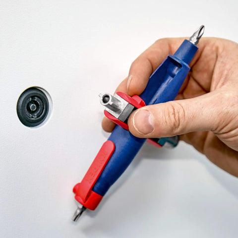 Hand holding a Pen Style Control Cabinet Key With Swivel Four Profile Heads, Eight And One Eighth Inch Long, used on a panel lock.