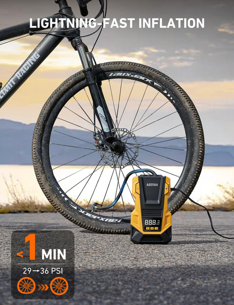 Dual Power Portable Tire Inflator With AC And DC Power, 150 PSI Max, LED Light, next to bike wheel on road