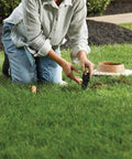 Person installing Smart Wireless Soil Sensor For Lawn And Garden Automatic Moisture Meter With 1 3 And 5 Inch Depth Monitoring