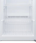 Interior view of Total Game Changer 17 Cu Foot Convertible Upright Freezer And Fridge with wire racks and storage basket.